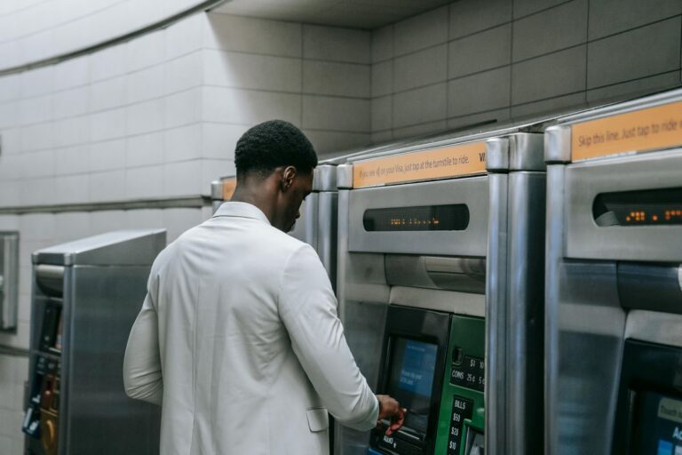 Man at ATM representing starting to invest