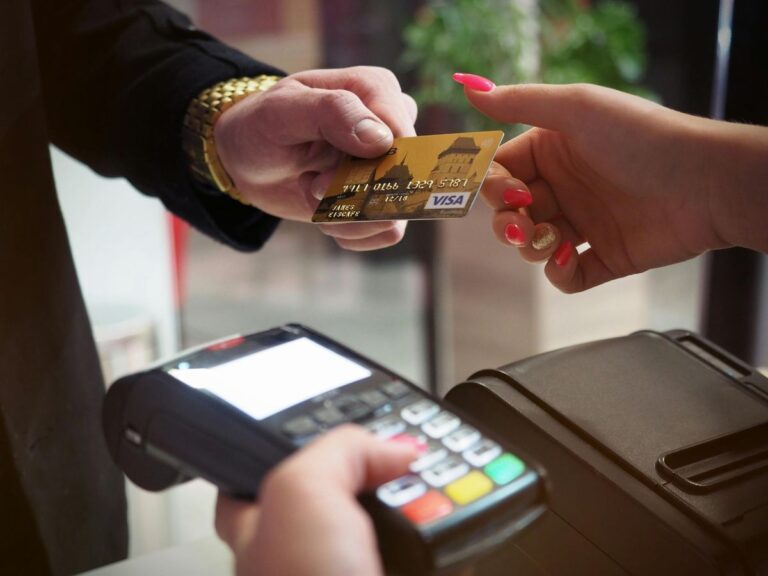 Visa credit card at payment terminal