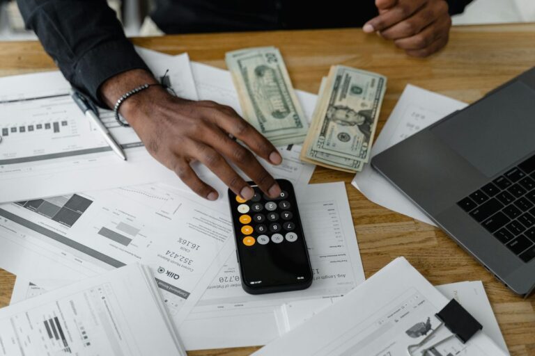 Calculator and bills on desk for budget planning