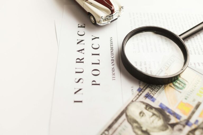 Insurance document with magnifier for financial planning