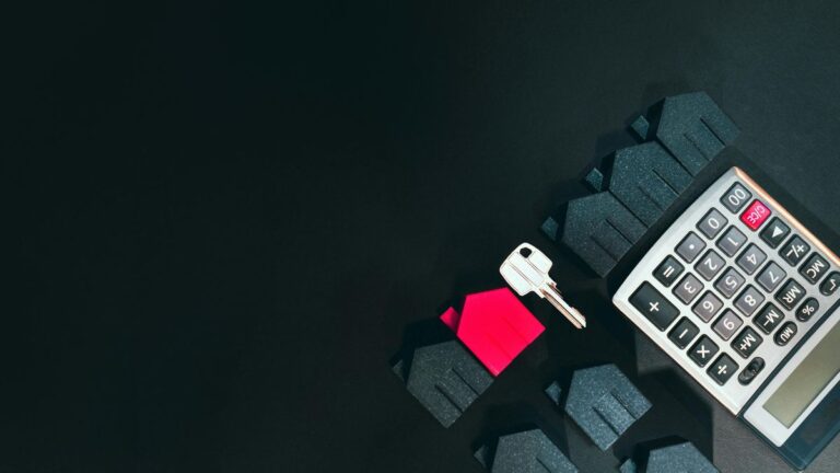 House key and calculator representing loan approval process